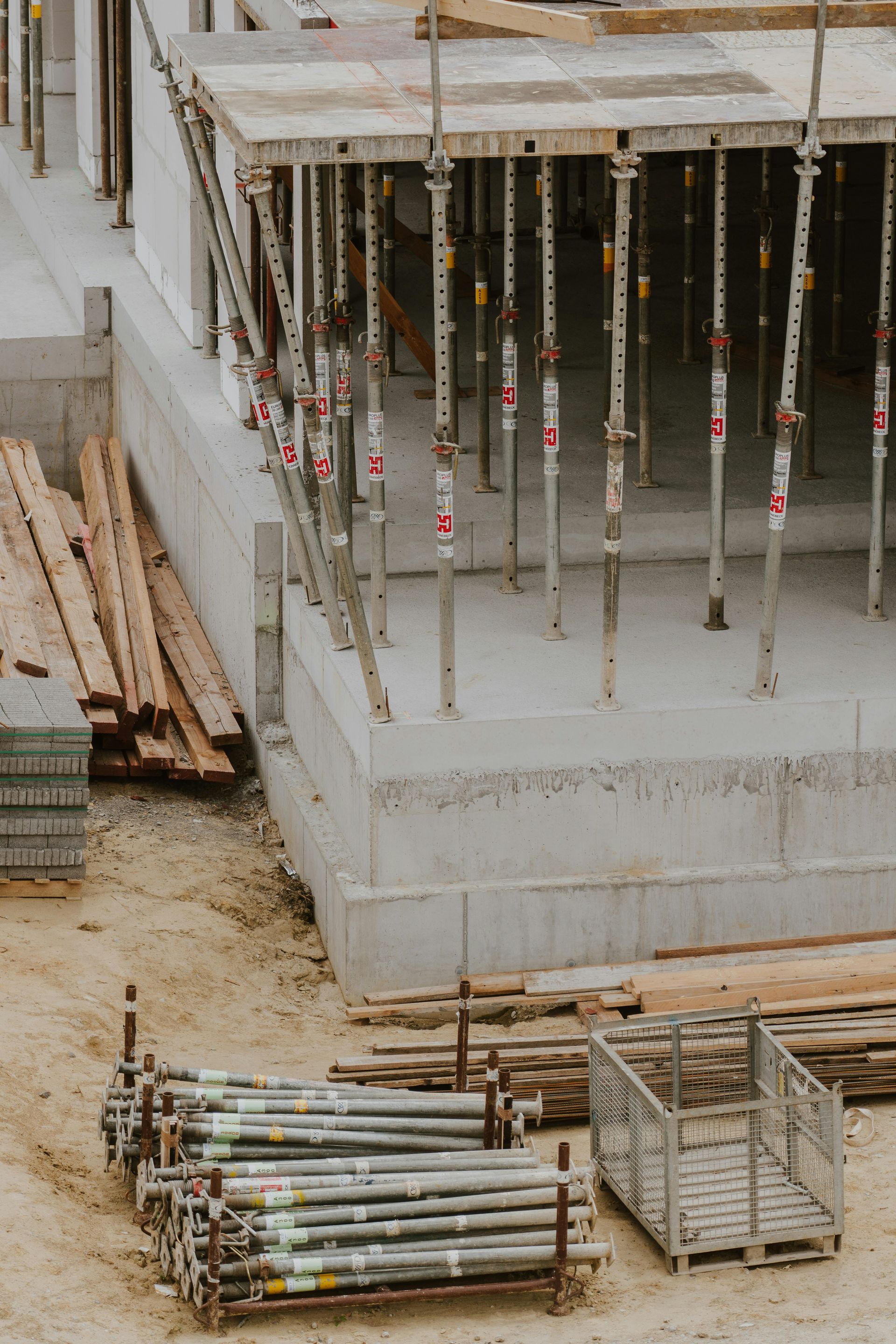 a building under construction with lots of wooden beams